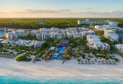 arial image of hotel/apartment buildings beside ocean