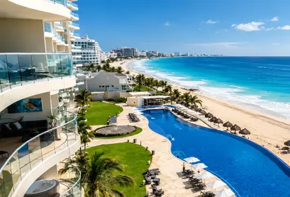 image from hotel balcony of pool and beachfront